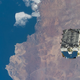 The external pallet packed with old nickel-hydrogen batteries, photographed shortly after being released by the Canadarm2 robotic arm. The object was orbiting 265 miles (427 km) above Chile when this photo was taken from the ISS.